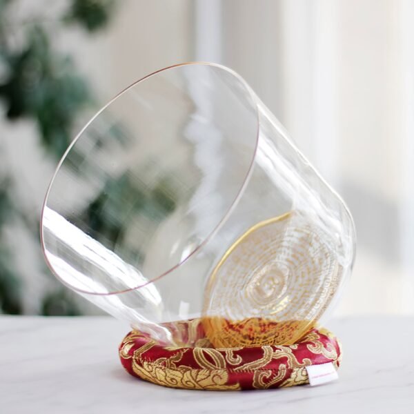 clear crystal singing bowl with gold buddhist mantra design