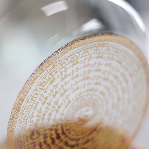 clear crystal singing bowl with gold buddhist mantra design