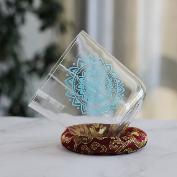 clear crystal singing bowl with throat chakra design