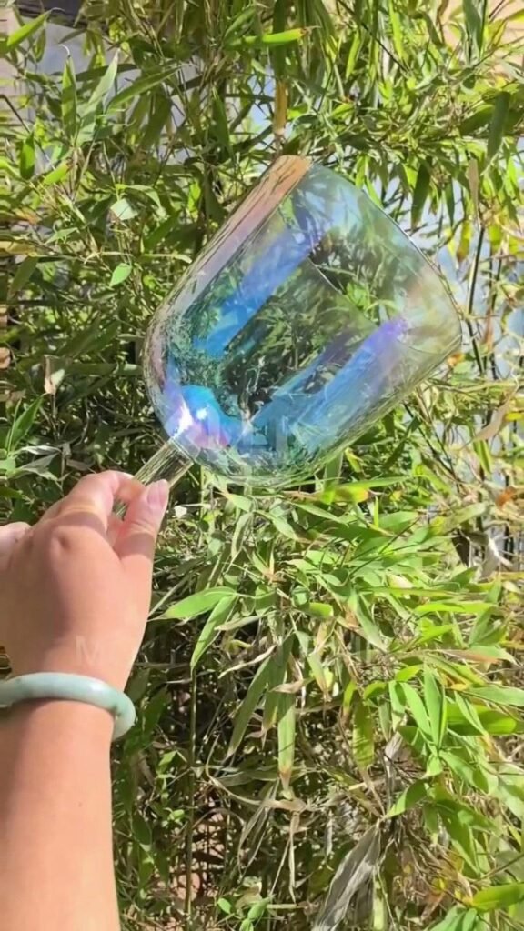 the subtle opalescent iridescent handheld crystal singing bowl (practitioner)