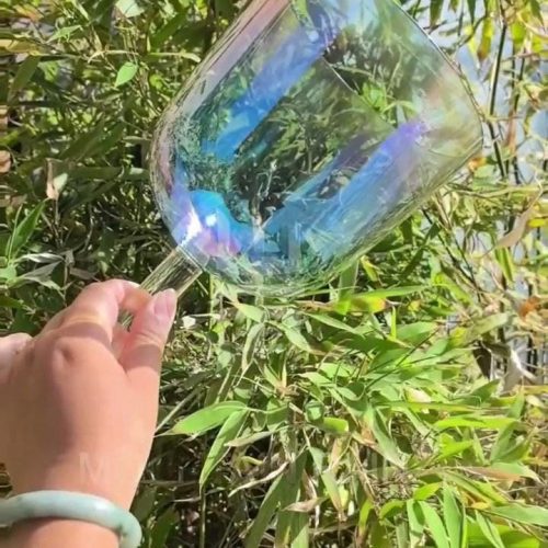 the subtle opalescent iridescent handheld crystal singing bowl (practitioner)
